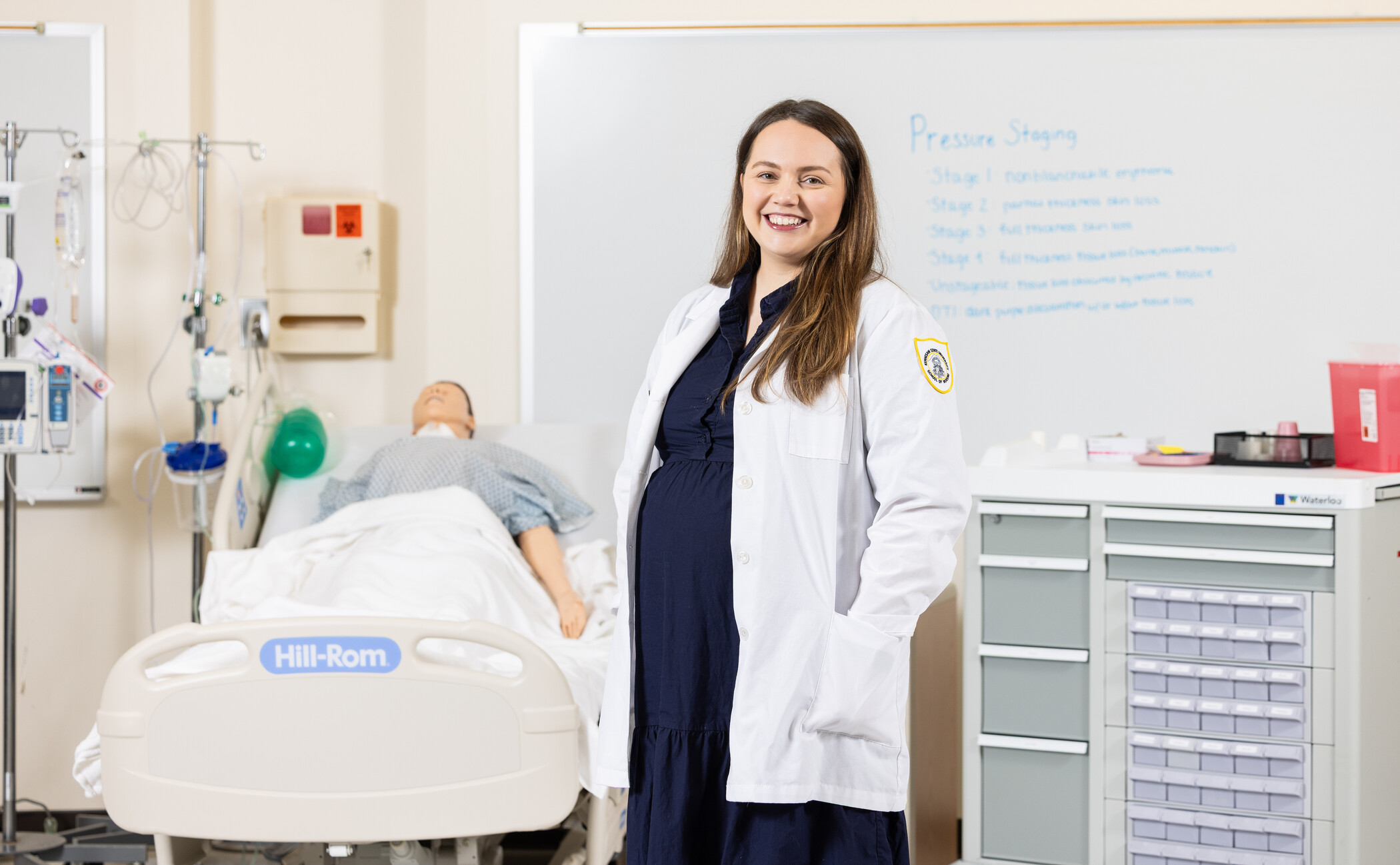 researcher posing in nursing simulation lab.