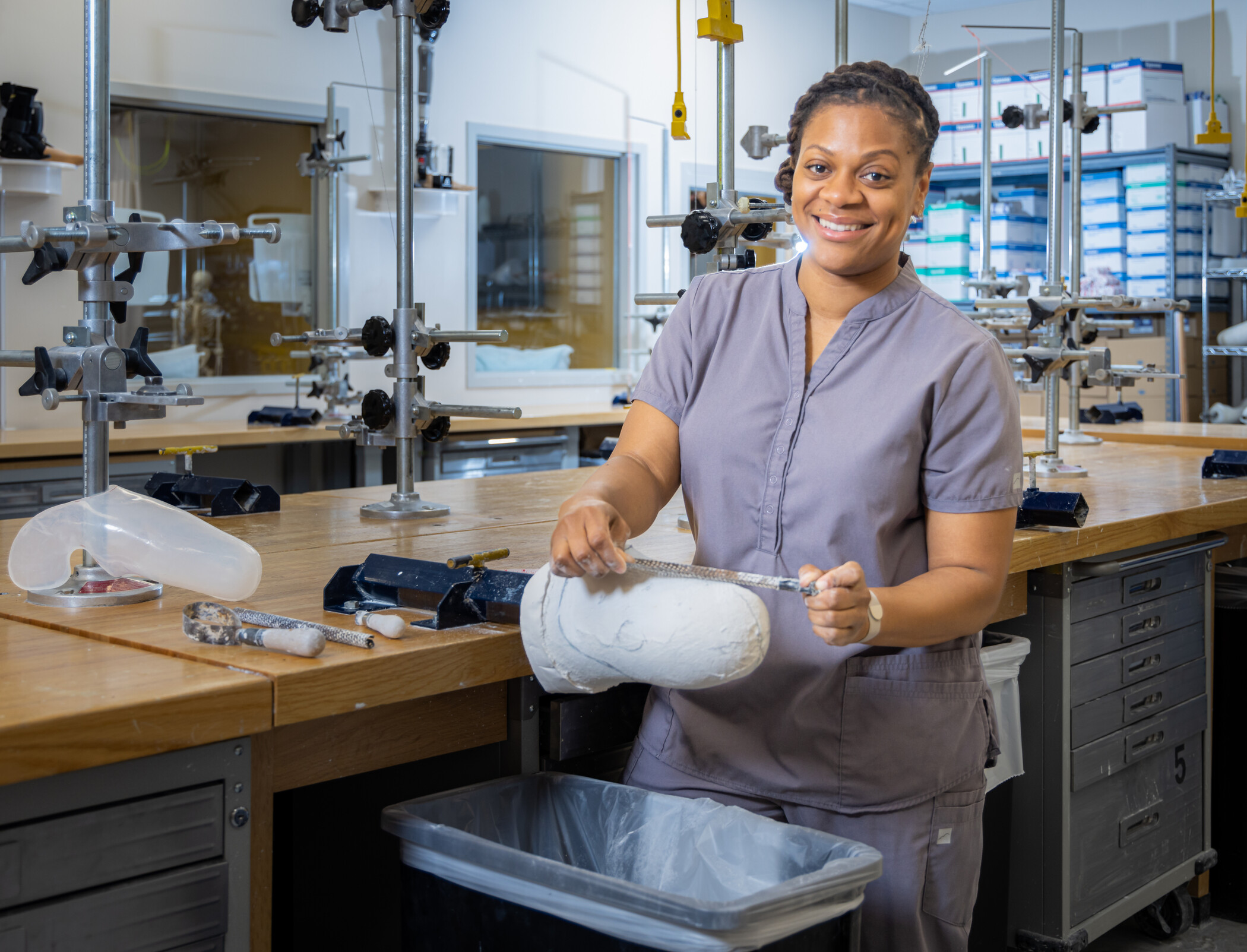 researcher working on a model in the biomechanics lab.