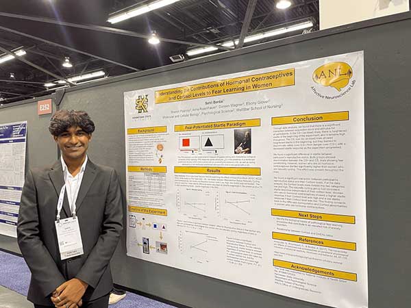 Sahil Bardai Standing next to his research who turned his passion for mental health into a rewarding undergraduate research career.